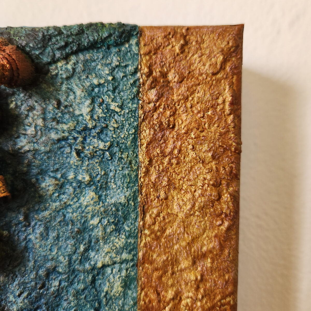 mixed media art. Textured green with attachments giving a greater 3D effect.