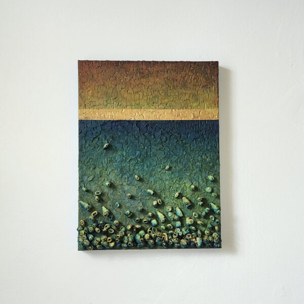 mixed media art. Textured green with attachments giving a greater 3D effect.