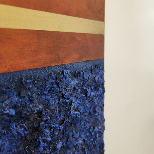 detail picture. Mixed Media art. Three sections total. top and bottom are blue textured sections. middle is aged orange with two lines of gold near top and bottom.