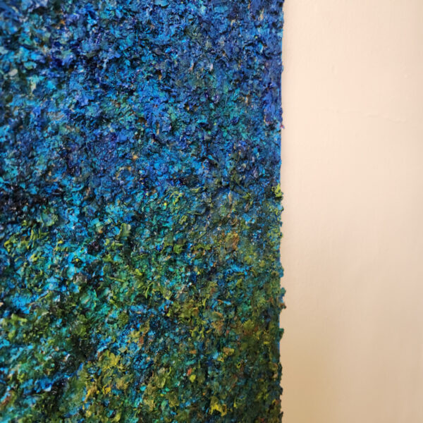 Detail picture. Mixed Media art. Top is aged orange. Bottom is green to blue textured gradient.