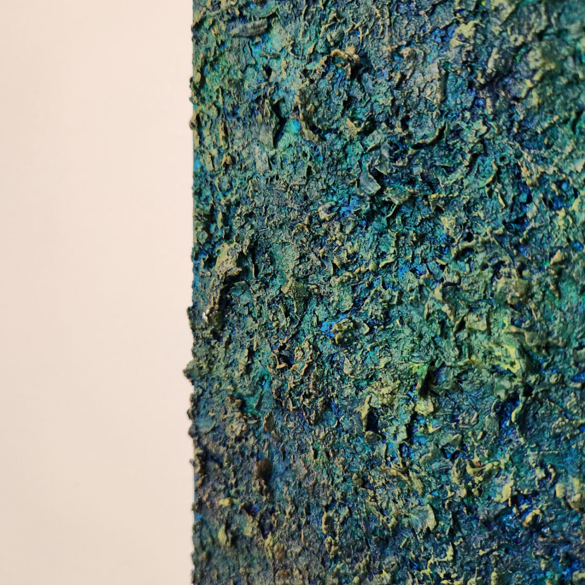 Detail picture: Mixed Media Art. textured green surrounded by aged orange.