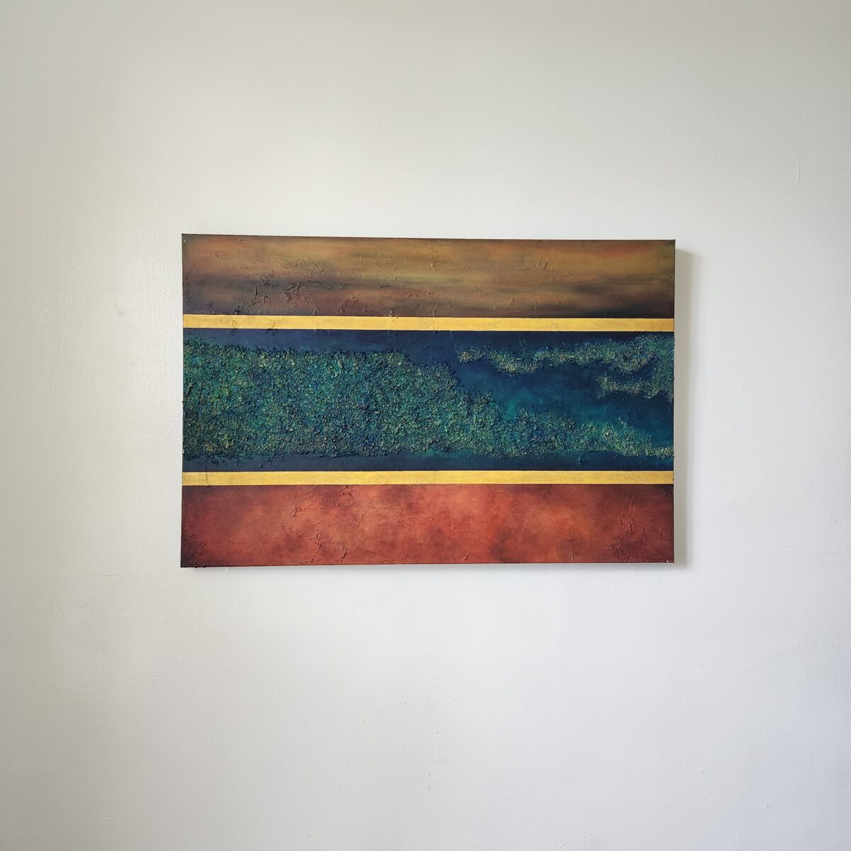 Mixed Media Art. textured green surrounded by aged orange.